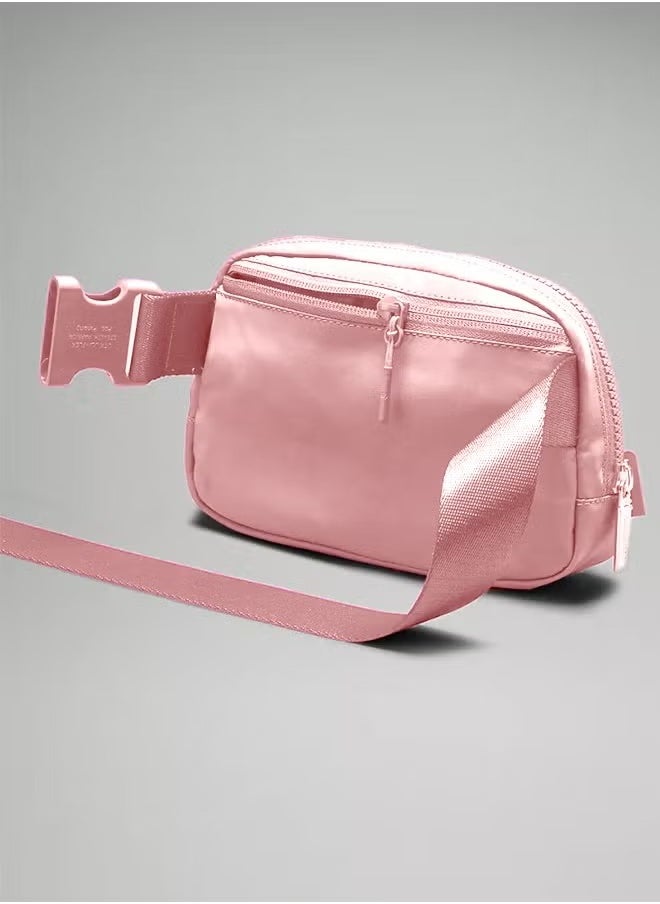 Everywhere Belt Bag, Compact, and Convenient Belly Bag with Zippered Pockets, Easy-Access Exterior Pocket, and Interior Essentials Pocket for On-the-Go Storage, Pink