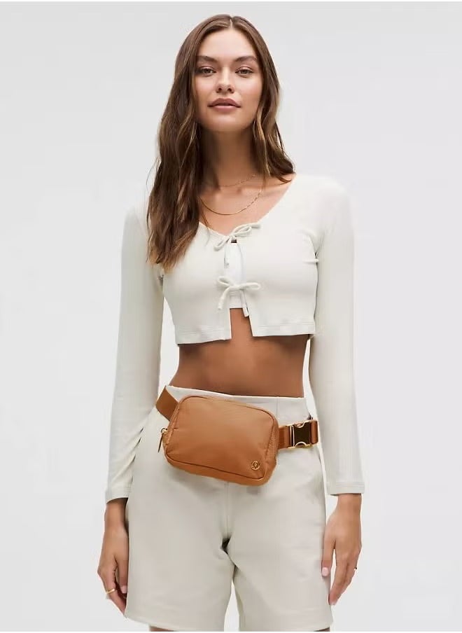 Everywhere Belt Bag, Compact and Convenient Belly Bag with Zippered Pockets, Easy Access Exterior Pocket and Interior Essentials Pocket for On the Go Storage, Brown