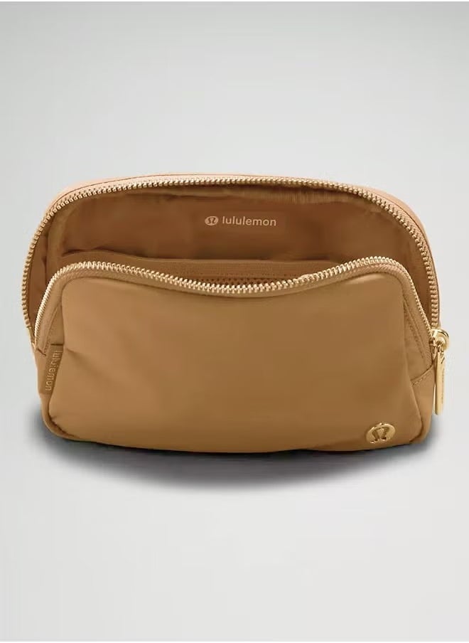 Everywhere Belt Bag, Compact and Convenient Belly Bag with Zippered Pockets, Easy Access Exterior Pocket and Interior Essentials Pocket for On the Go Storage, Brown