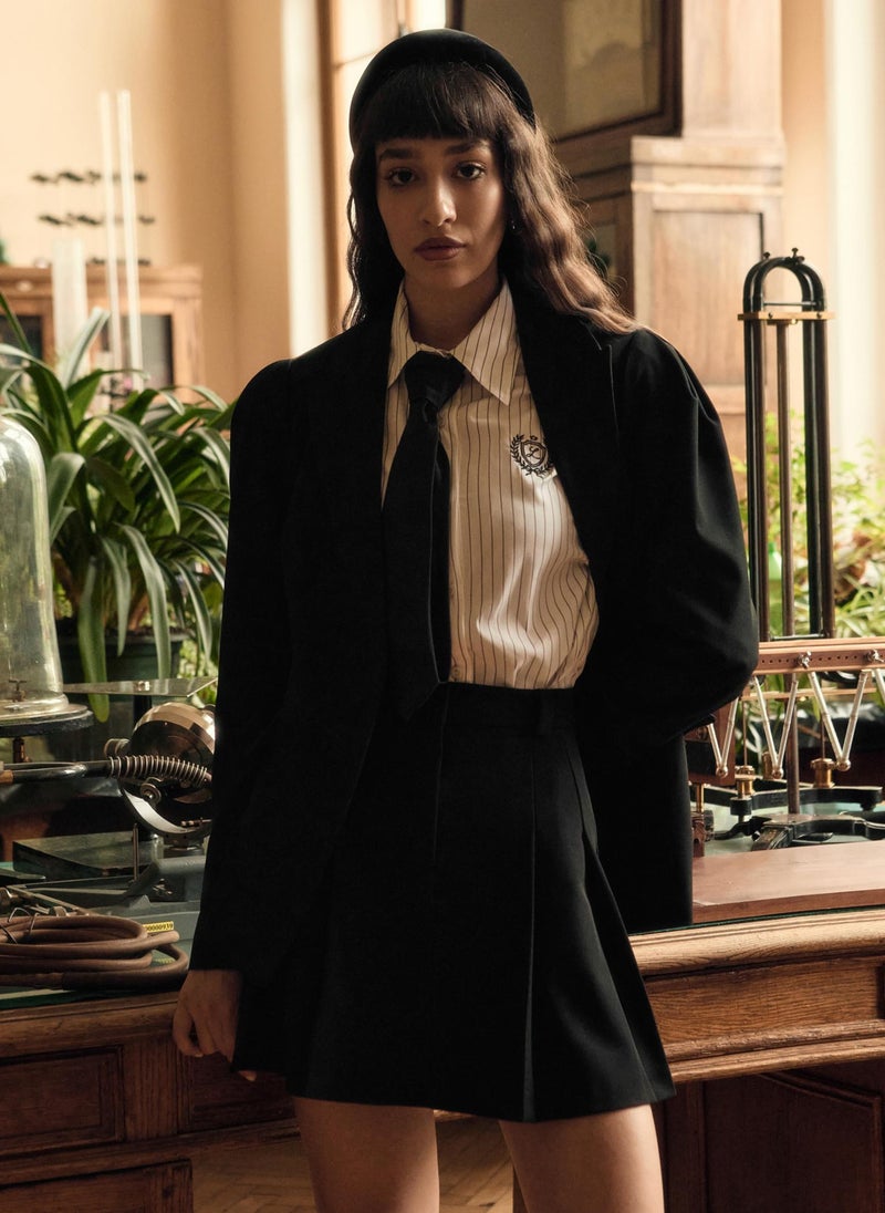 Flared jacket with voluminous sleeves