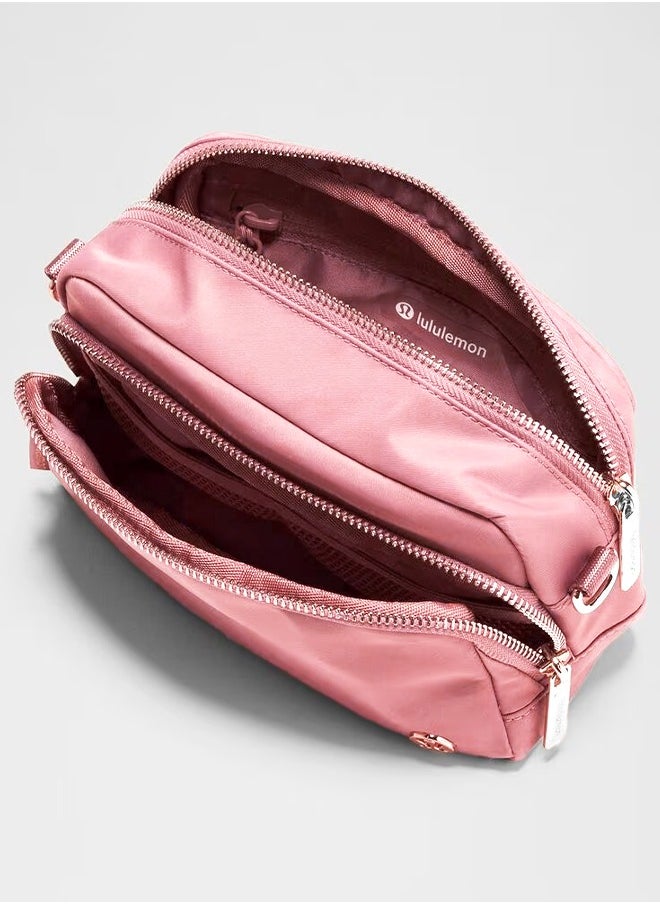 Everywhere Crossbody Bag – Compact and Convenient Belly Bag with Zippered Pockets, Easy-Access Exterior Pocket, and Interior Essentials Pocket for On-the-Go Storage, Pink