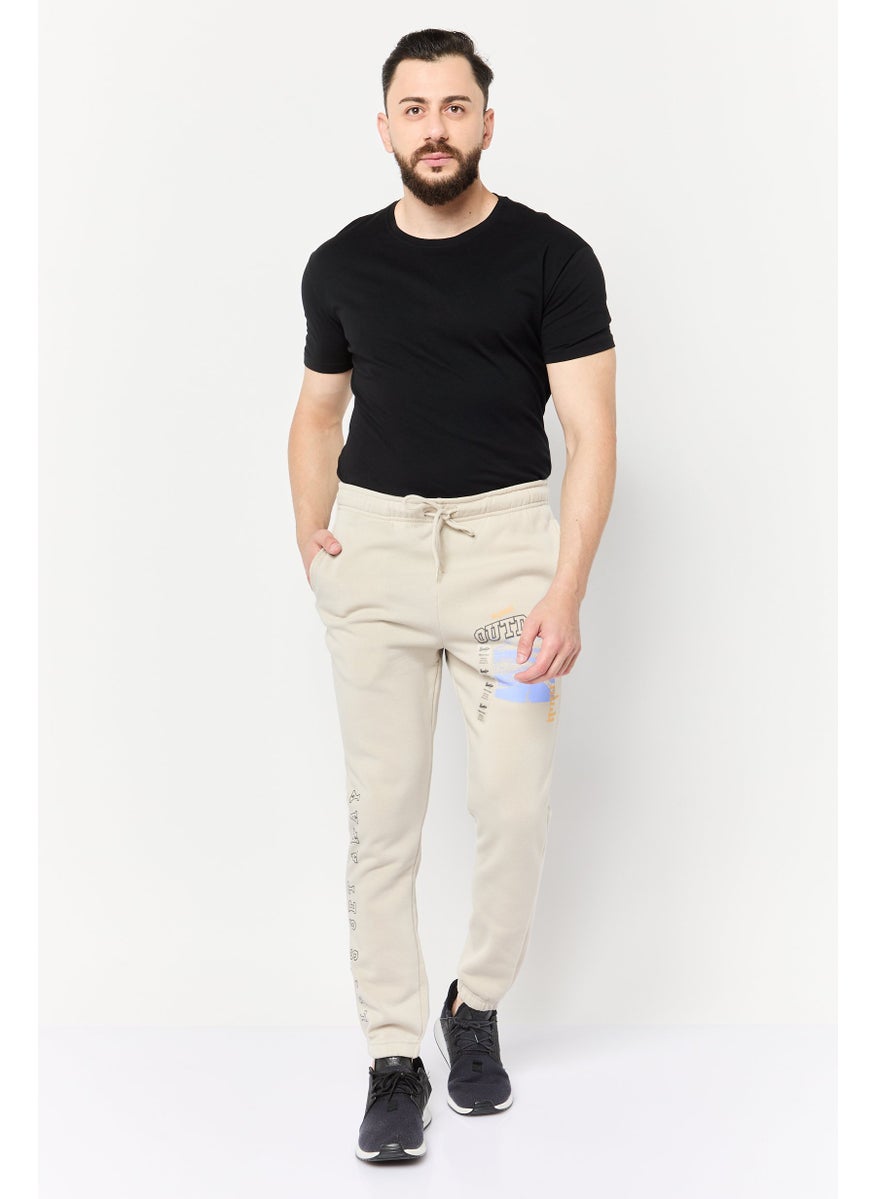 Men Regular Fit Graphic Print Jogger Pants, Beige