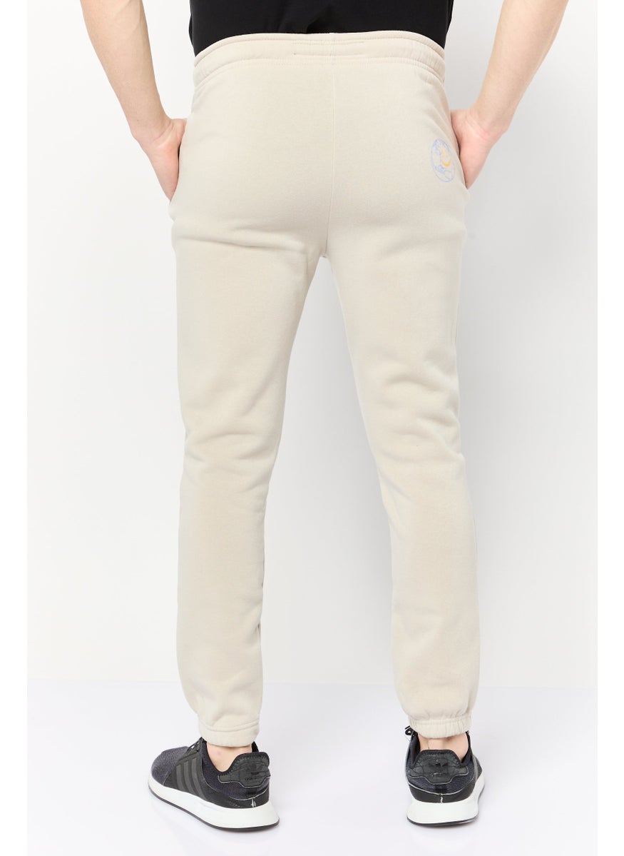 Men Regular Fit Graphic Print Jogger Pants, Beige