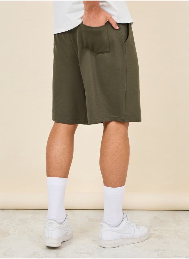 Oversized Solid Shorts with Drawstring Waistband