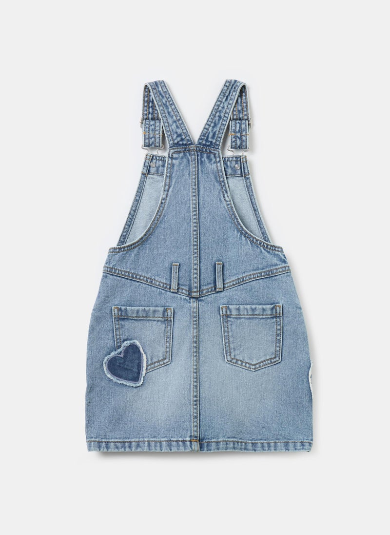 Pinafore in denim with heart embroidery