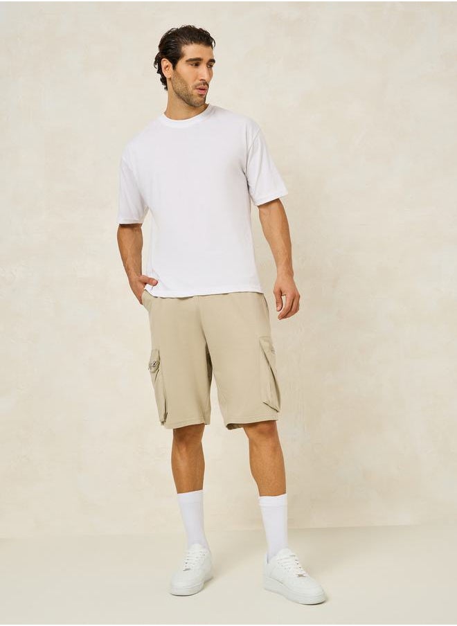 Solid Oversized Shorts with Cargo Pocket Detail
