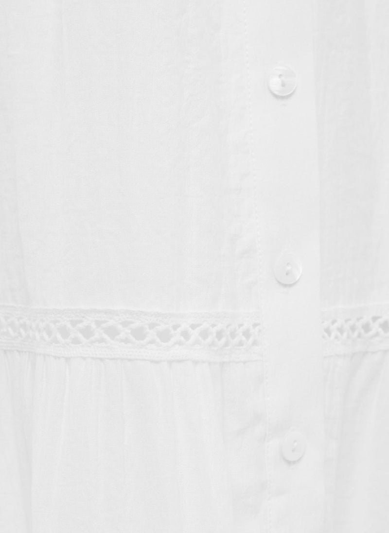 Voluminous maxi dress with collar ties