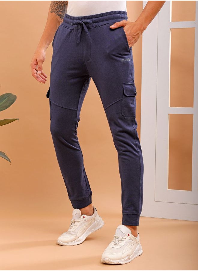 Men Slim Fit Solid Mid-Rise Stretchable Knitted Jogger Trousers
