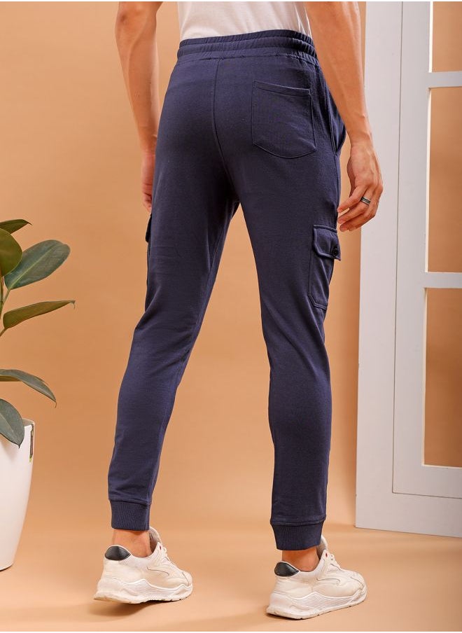 Men Slim Fit Solid Mid-Rise Stretchable Knitted Jogger Trousers