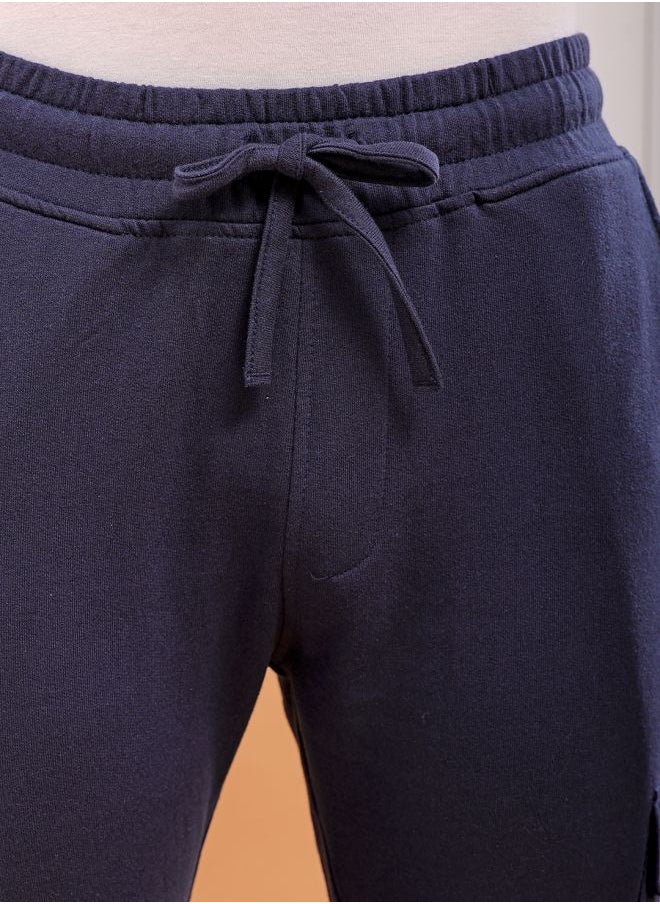 Men Slim Fit Solid Mid-Rise Stretchable Knitted Jogger Trousers