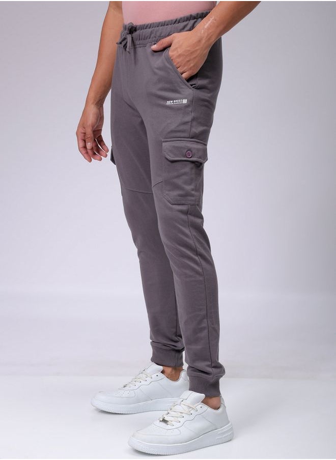 Men Slim Fit Solid Mid-Rise Stretchable Knitted Jogger Trousers