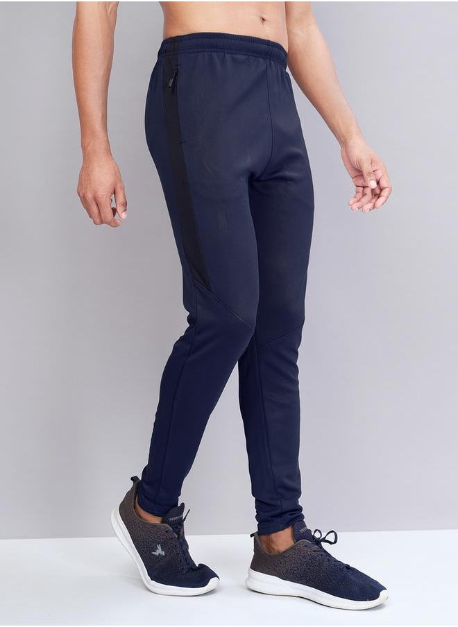 Men Solid Slim Fit Track Pants with TECHNO DRY by Styli