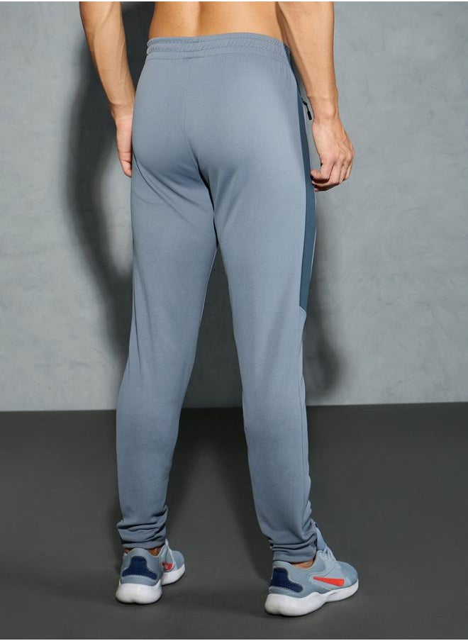 Men Solid Slim Fit Track Pants with TECHNO DRY by Styli