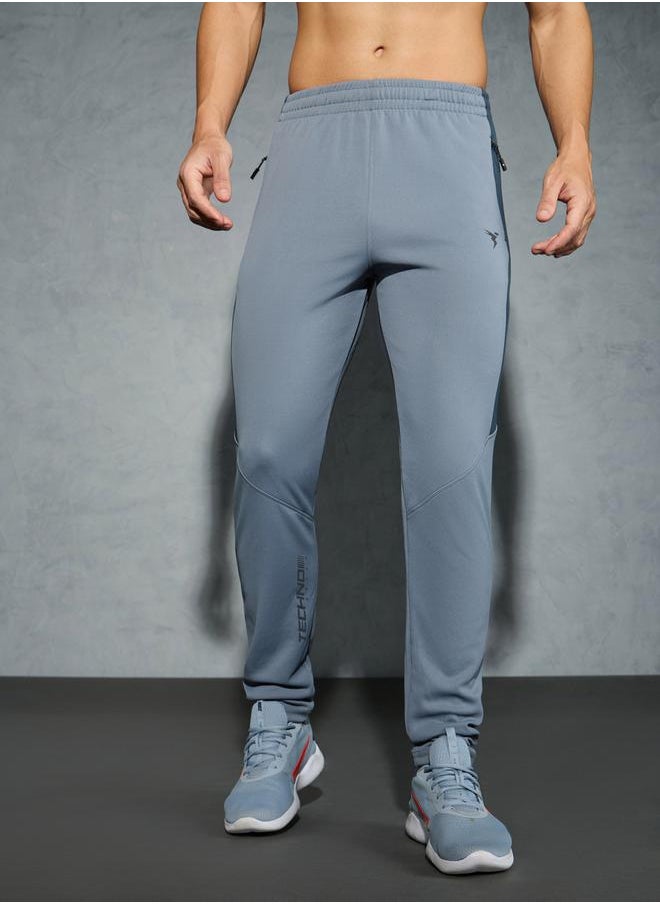 Men Solid Slim Fit Track Pants with TECHNO DRY by Styli