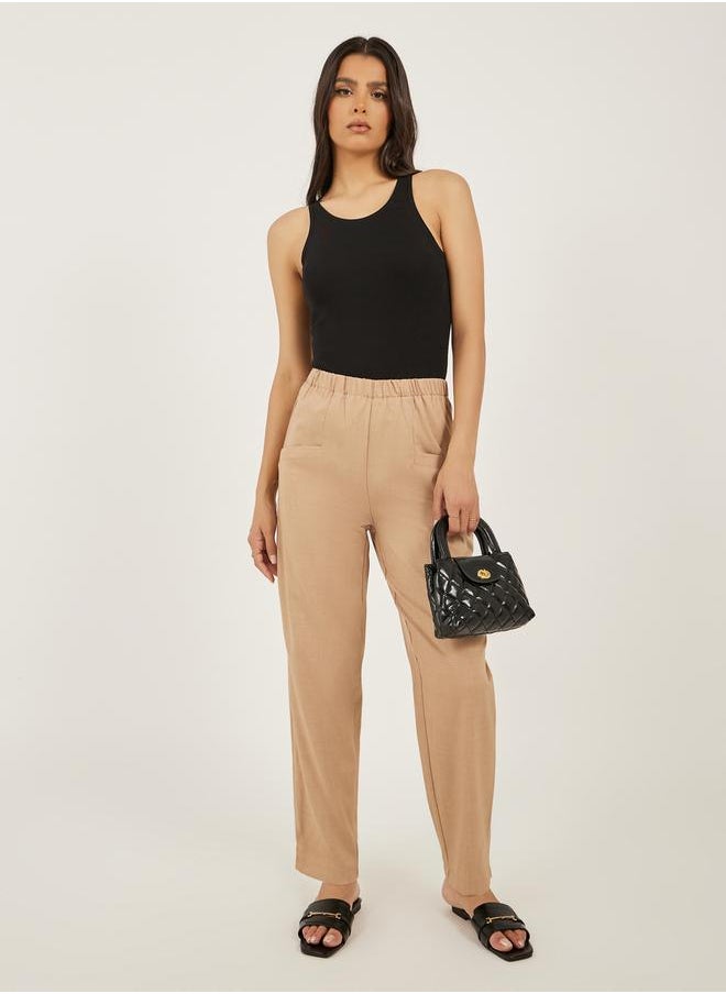 Solid Cropped Tapered Fit Pants with Baggy Pockets