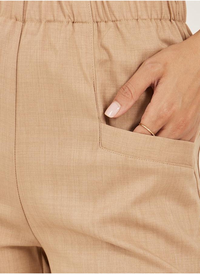 Solid Cropped Tapered Fit Pants with Baggy Pockets