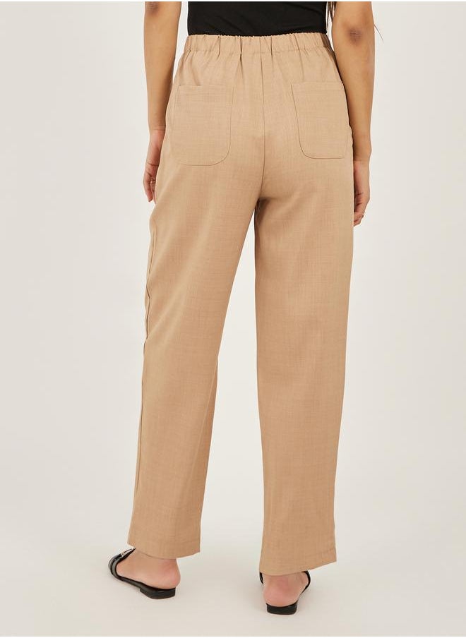 Solid Cropped Tapered Fit Pants with Baggy Pockets