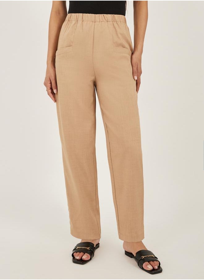 Solid Cropped Tapered Fit Pants with Baggy Pockets
