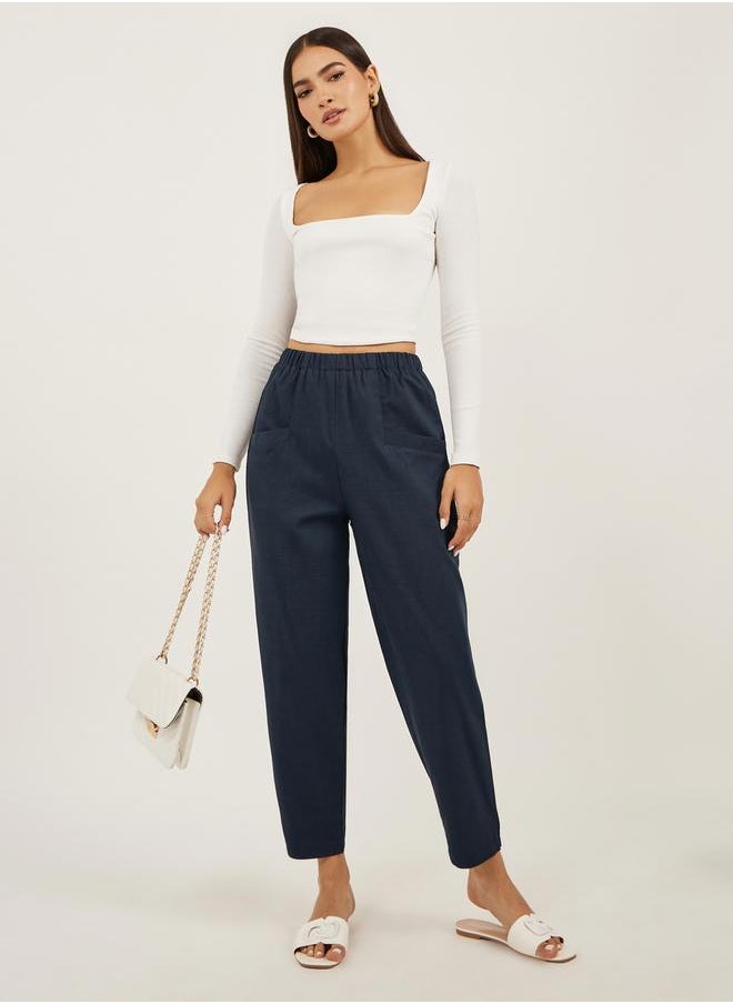 Solid Cropped Tapered Fit Pants with Baggy Pockets