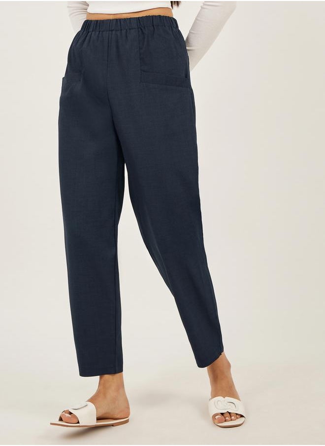 Solid Cropped Tapered Fit Pants with Baggy Pockets