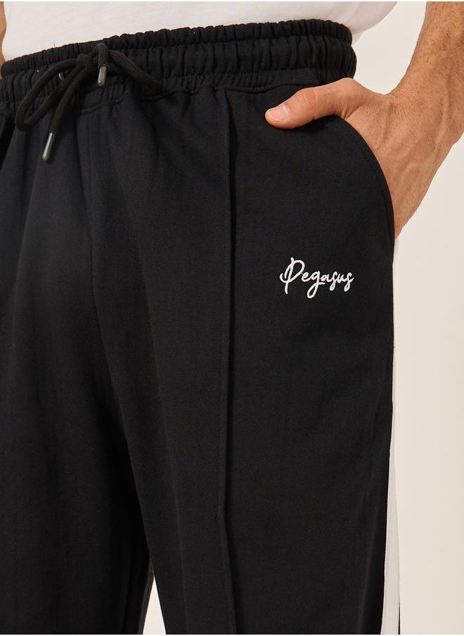 Oversized Wide Tuck Fleece Joggers with Side Stripe and Print Detail