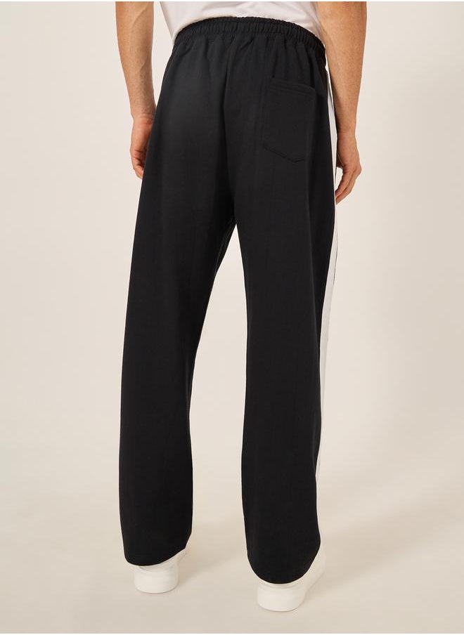 Oversized Wide Tuck Fleece Joggers with Side Stripe and Print Detail