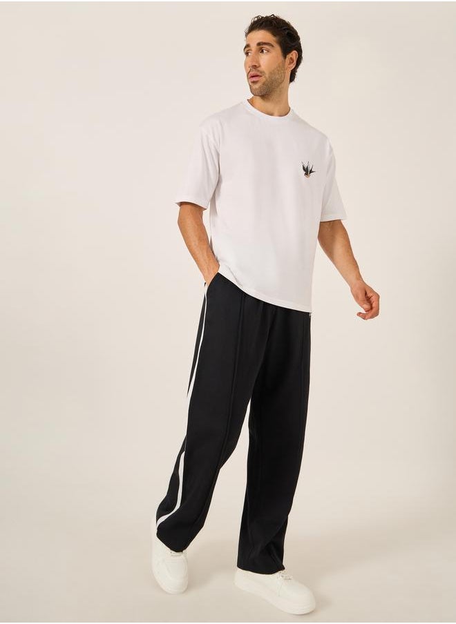 Oversized Wide Tuck Fleece Joggers with Side Stripe and Print Detail