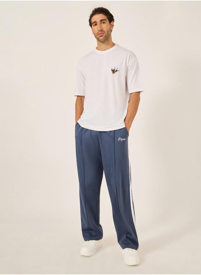 Oversized Wide Tuck Fleece Joggers with Side Stripe and Print Detail