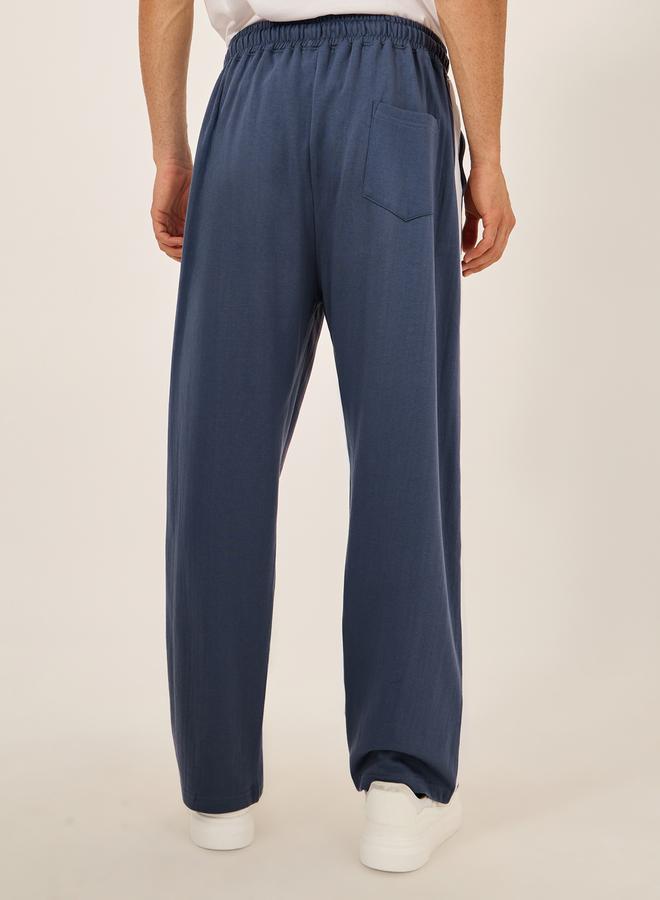 Oversized Wide Tuck Fleece Joggers with Side Stripe and Print Detail