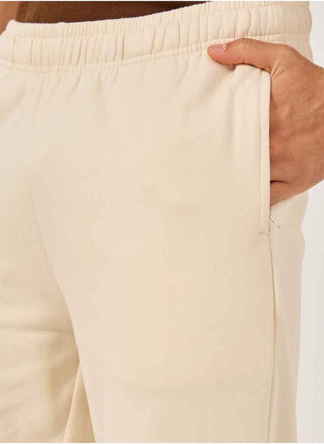 Mid Rise Relaxed Fit Joggers with Badge Detail