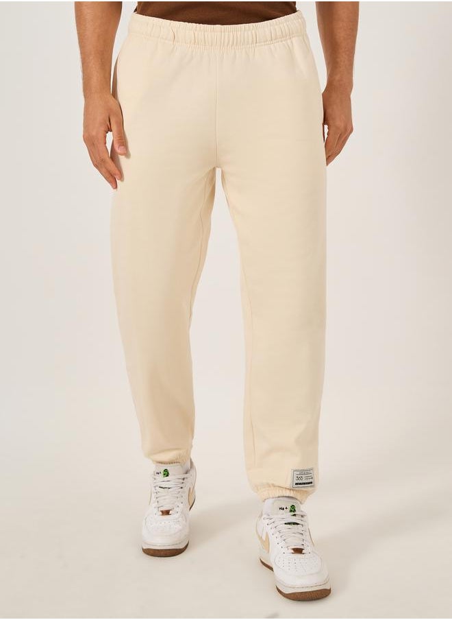 Mid Rise Relaxed Fit Joggers with Badge Detail