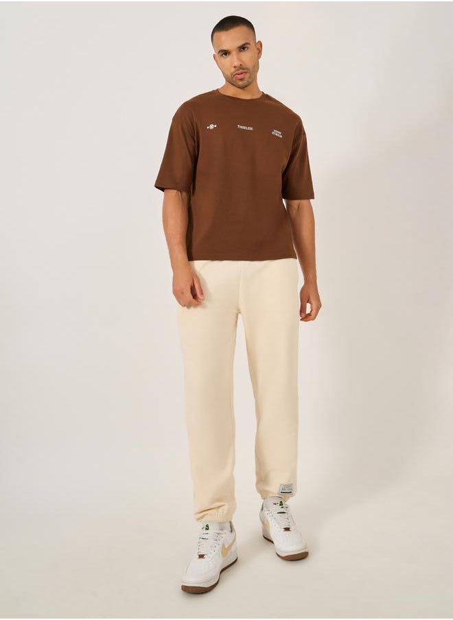 Mid Rise Relaxed Fit Joggers with Badge Detail