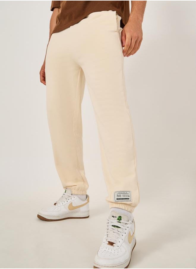 Mid Rise Relaxed Fit Joggers with Badge Detail