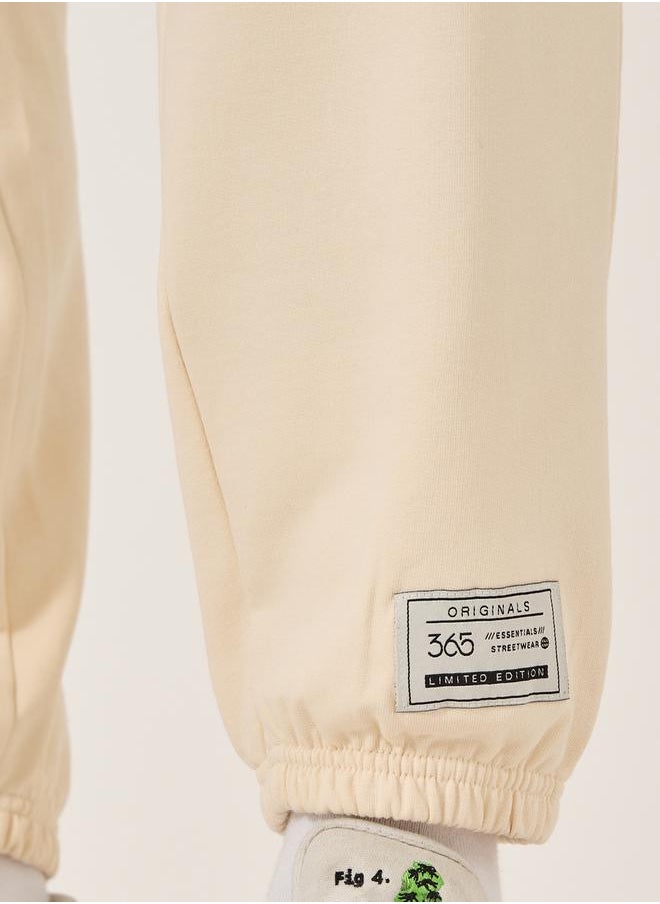 Mid Rise Relaxed Fit Joggers with Badge Detail