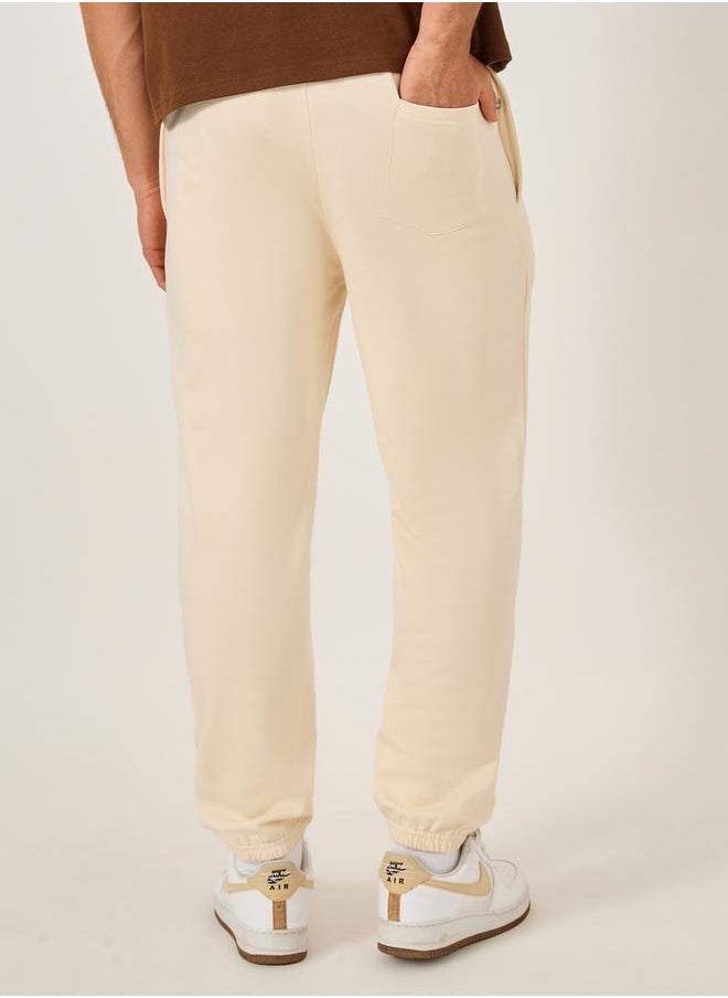 Mid Rise Relaxed Fit Joggers with Badge Detail