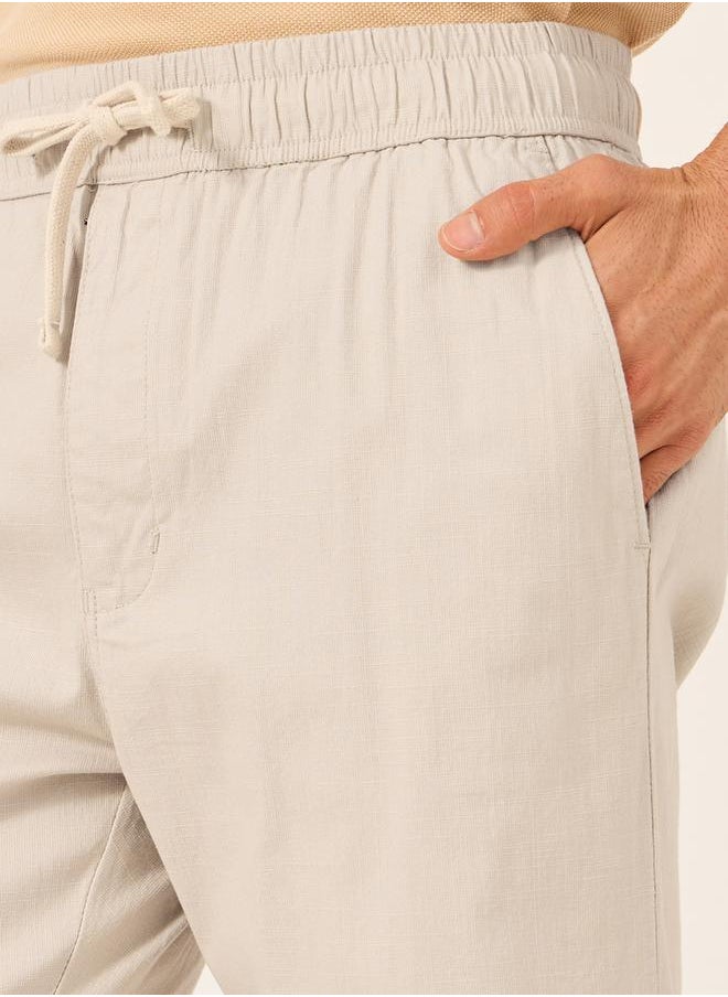 Solid Relaxed Fit Elasticated Cuffed Joggers with Contrast Drawstring