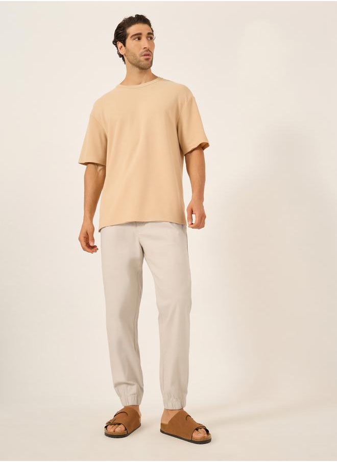 Solid Relaxed Fit Elasticated Cuffed Joggers with Contrast Drawstring