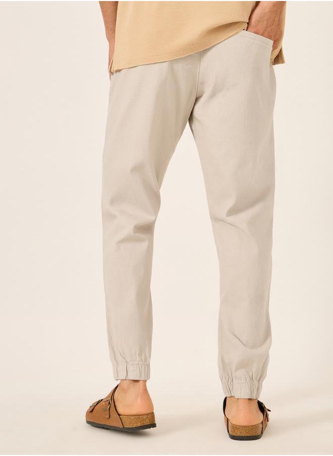 Solid Relaxed Fit Elasticated Cuffed Joggers with Contrast Drawstring