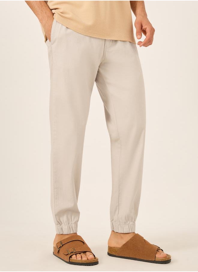 Solid Relaxed Fit Elasticated Cuffed Joggers with Contrast Drawstring