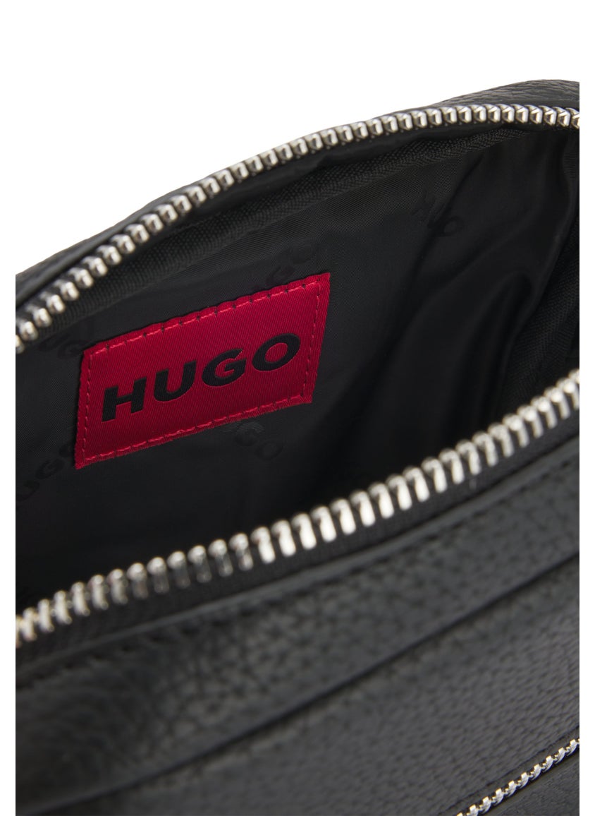 Grained faux-leather reporter bag with rubber logo patch