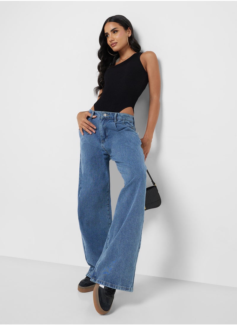 Mid Rise Flared Jeans With Pleat Detail
