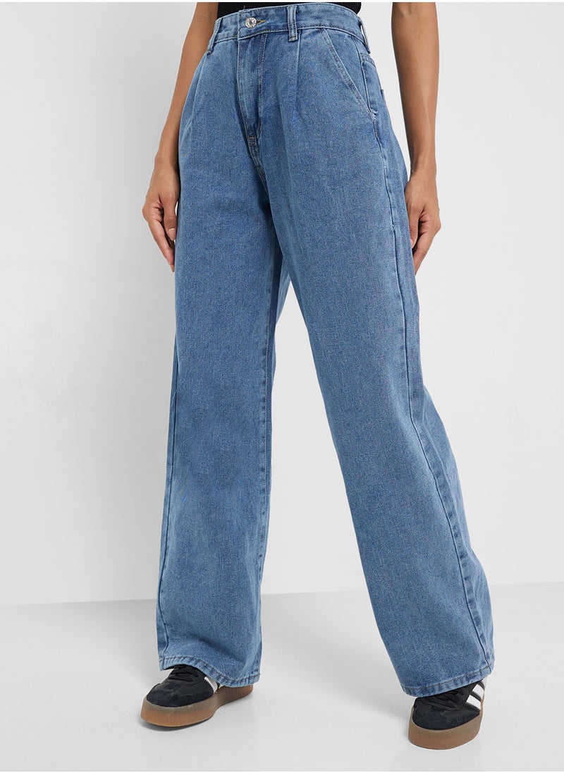 Mid Rise Flared Jeans With Pleat Detail