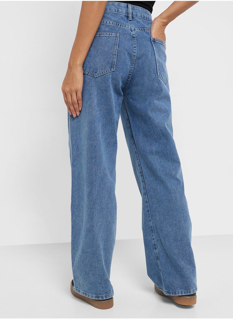 Mid Rise Flared Jeans With Pleat Detail