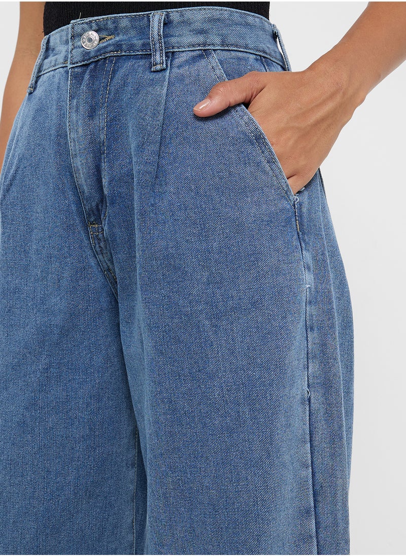 Mid Rise Flared Jeans With Pleat Detail