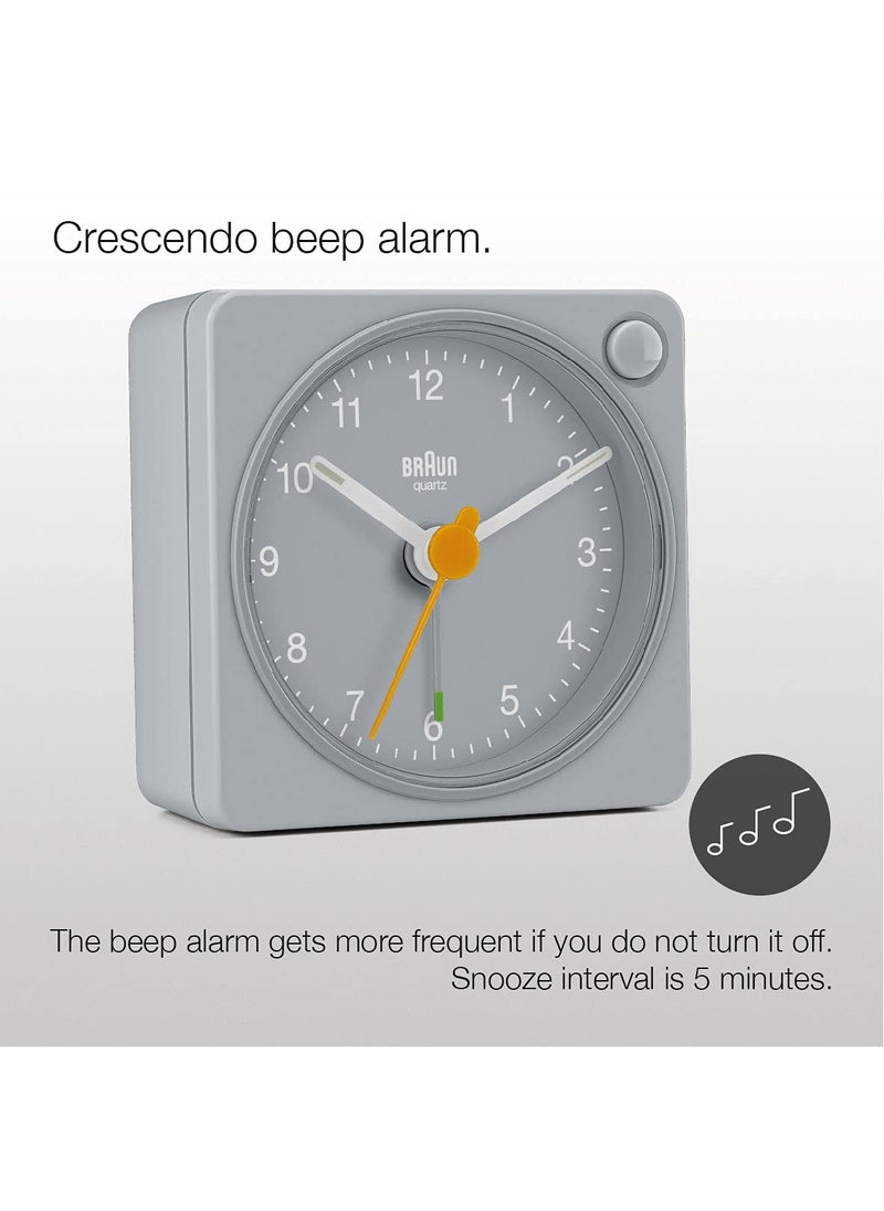 Braun Classic Travel Analogue Alarm Clock with Snooze and Light Compact Size Quiet Quartz Movement Crescendo Beep Alarm in Grey Model BC02XG