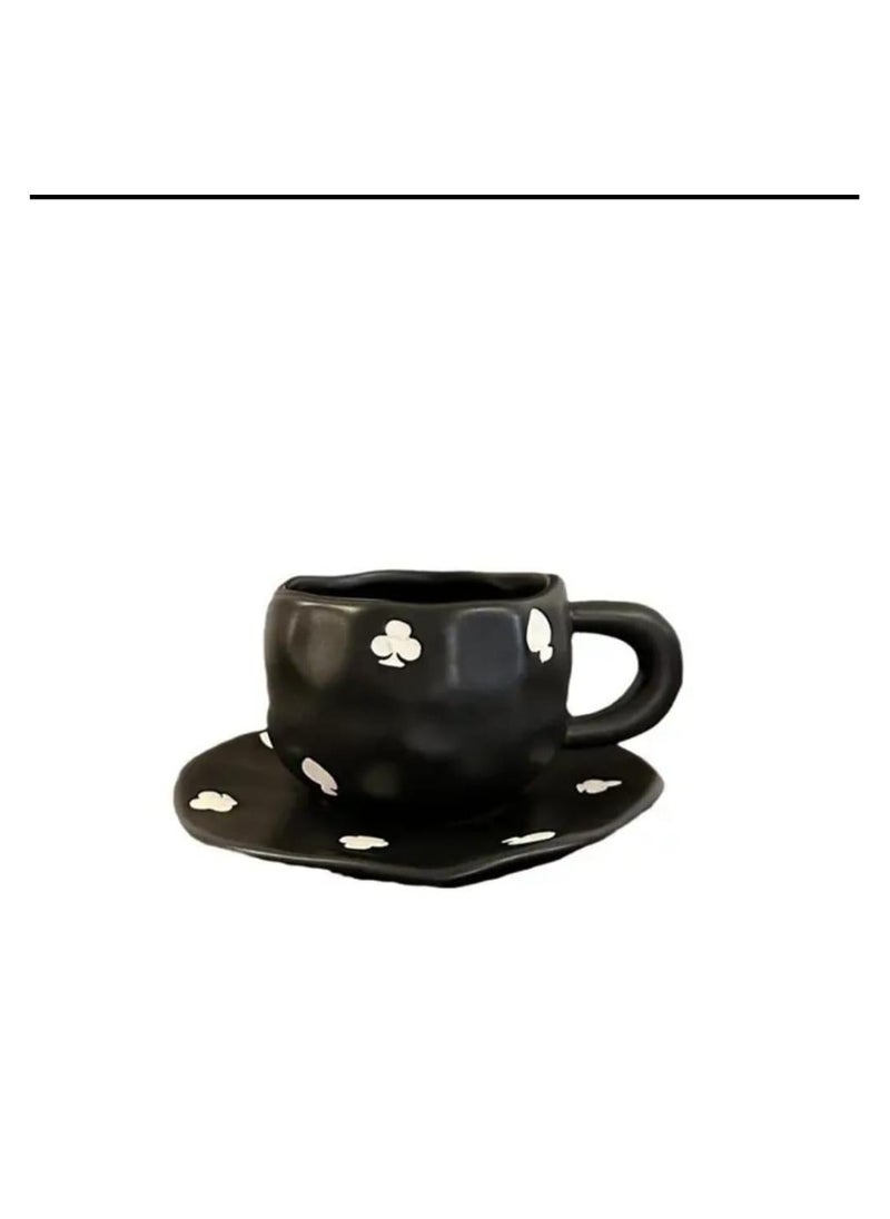 Elegant black ceramic mug with attractive white designs.