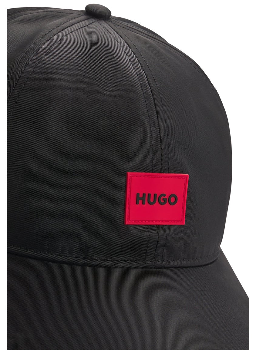 Six-panel cap with silicone logo patch