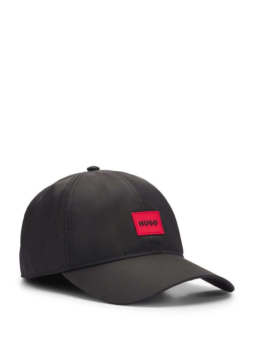 Six-panel cap with silicone logo patch