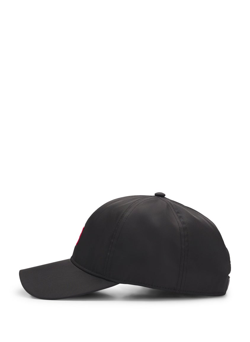 Six-panel cap with silicone logo patch