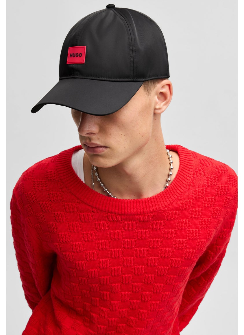 Six-panel cap with silicone logo patch